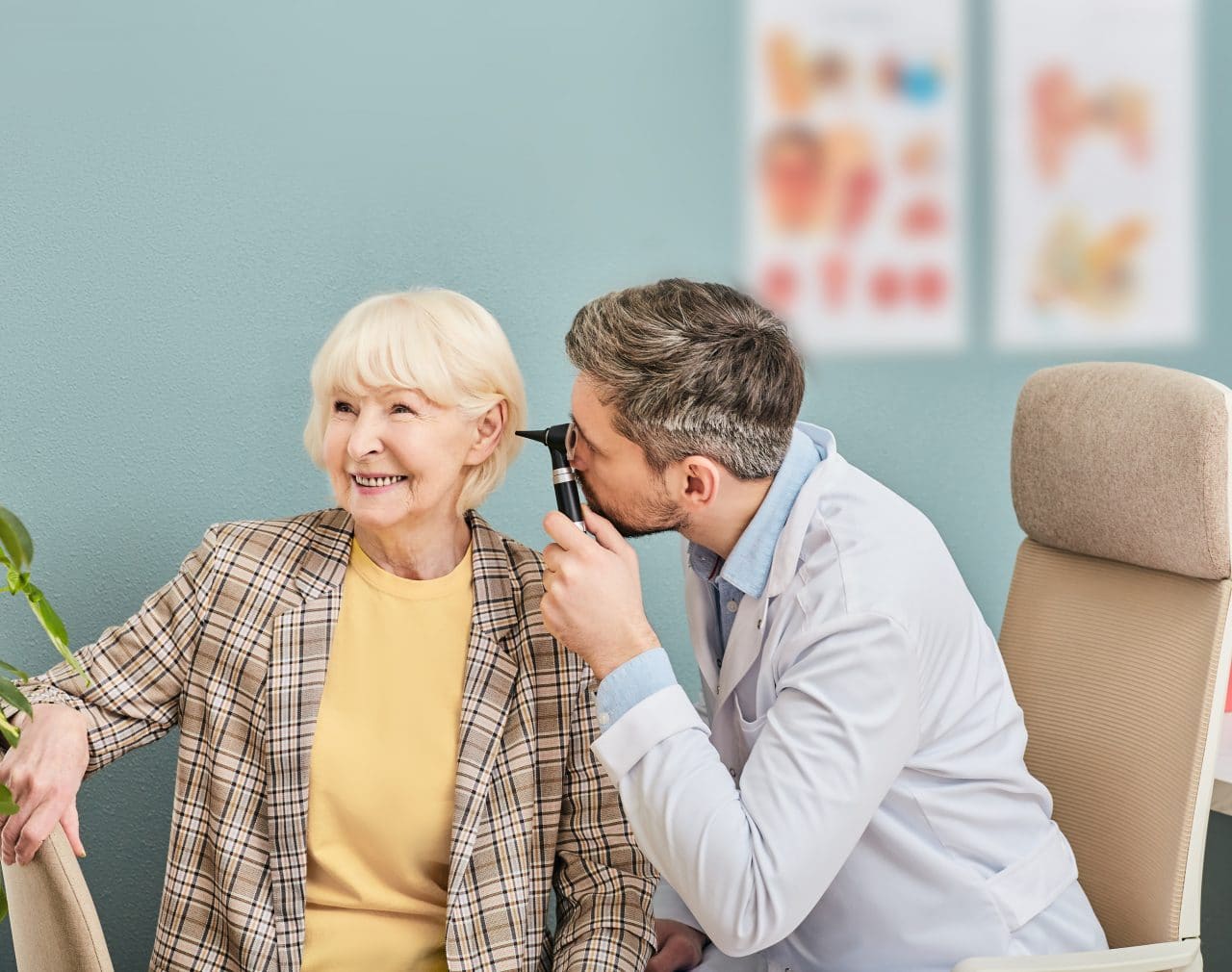 Woman having her ears examined by an audiologist.